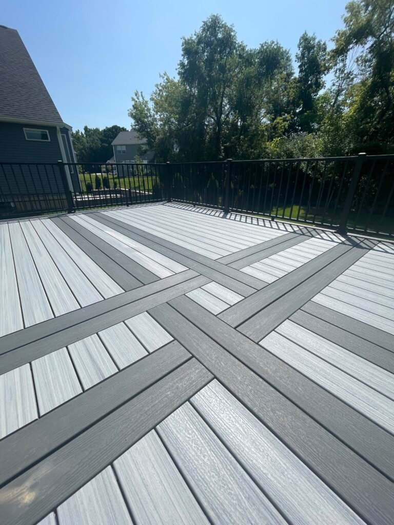 custom trex transcend spiced rum composite deck with signature aluminum railing and knot deck inlay