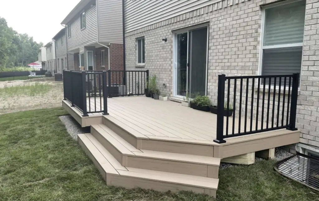 Trex composite deck with wrap around stairs and railing