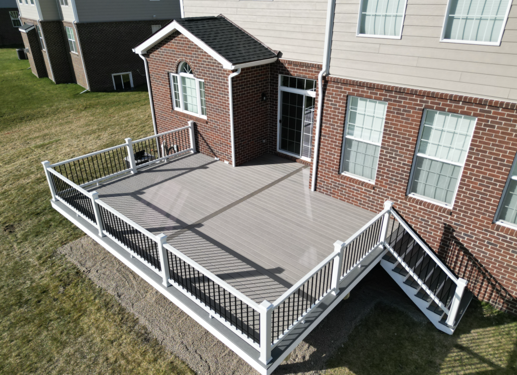 Trex composite deck with white composite deck railing and pvc fascia