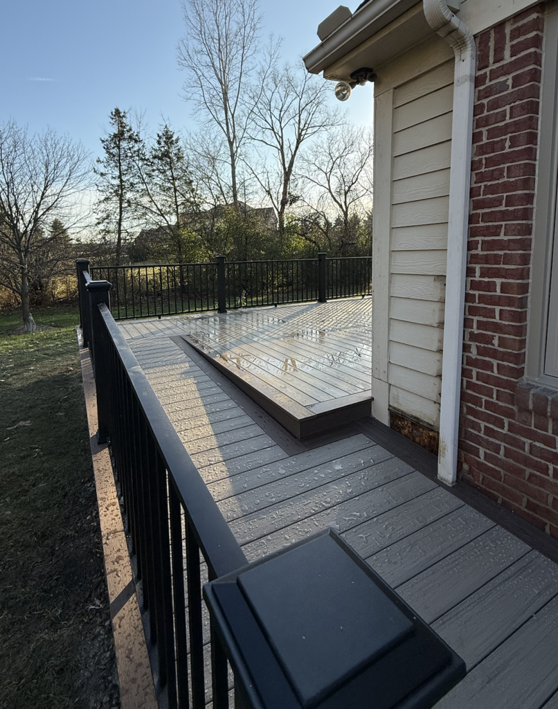 Composite deck with railing and accessibility ramp